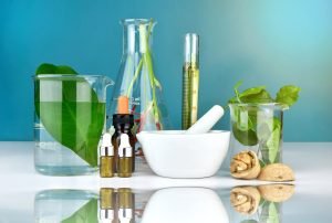 Natural organic medicine and healthcare, Alternative plant medicine, Mortar and herbal extraction in laboratory glassware.