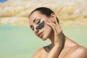 Woman,With,Black,Clay,Facial,Mask.,Beauty,And,Wellness.,Spa